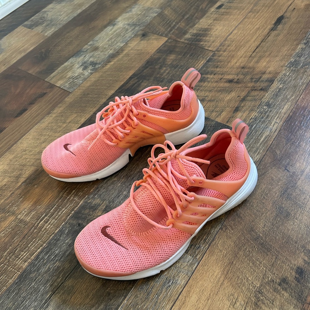 Nike Pink Athletic Shoes with Breathable Mesh and Cushioned Sole